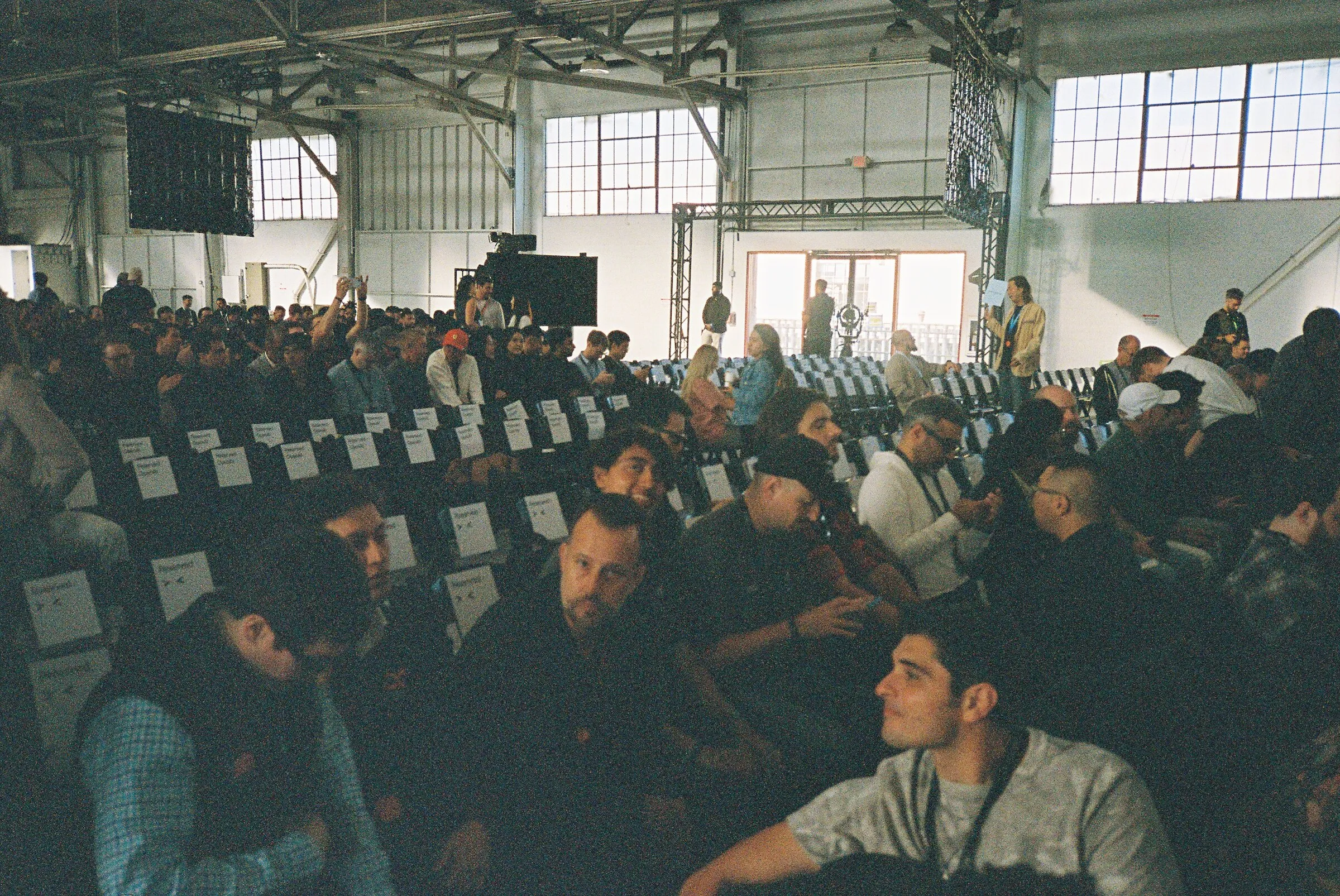 A packed hall of seated attendees