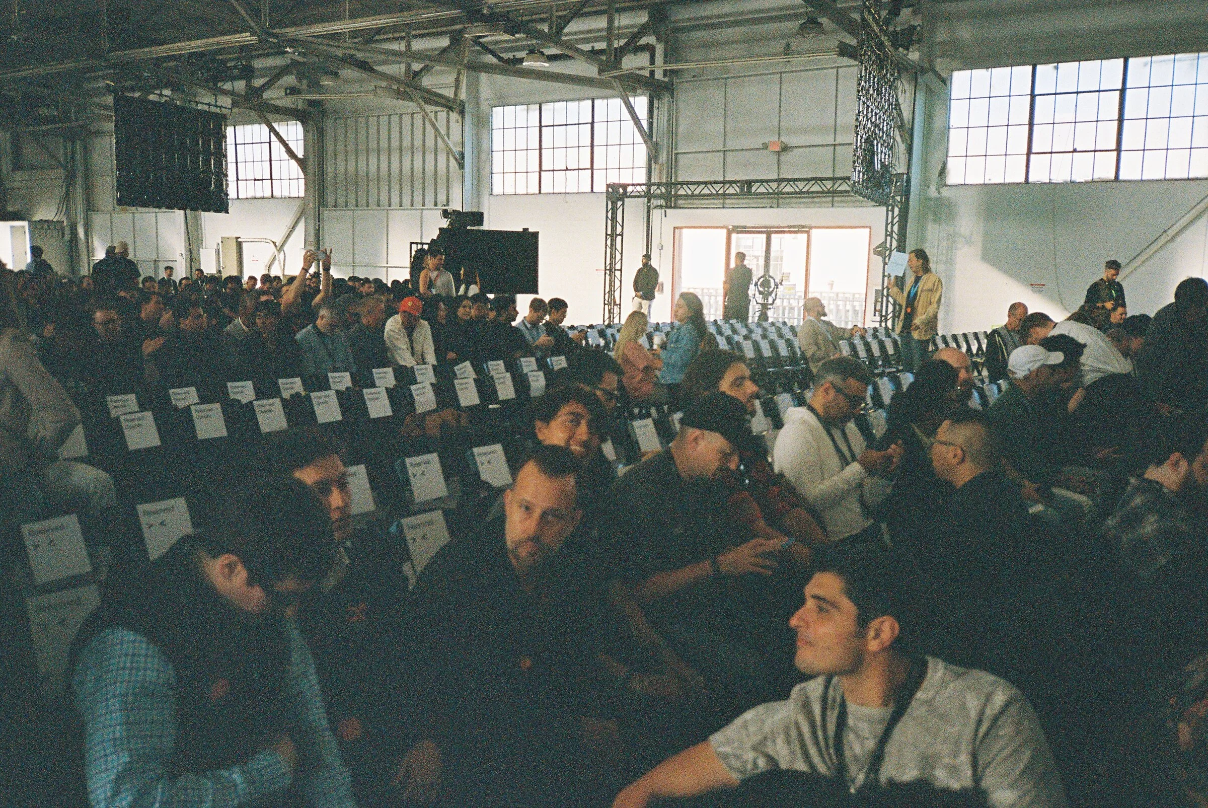 A packed hall of seated attendees