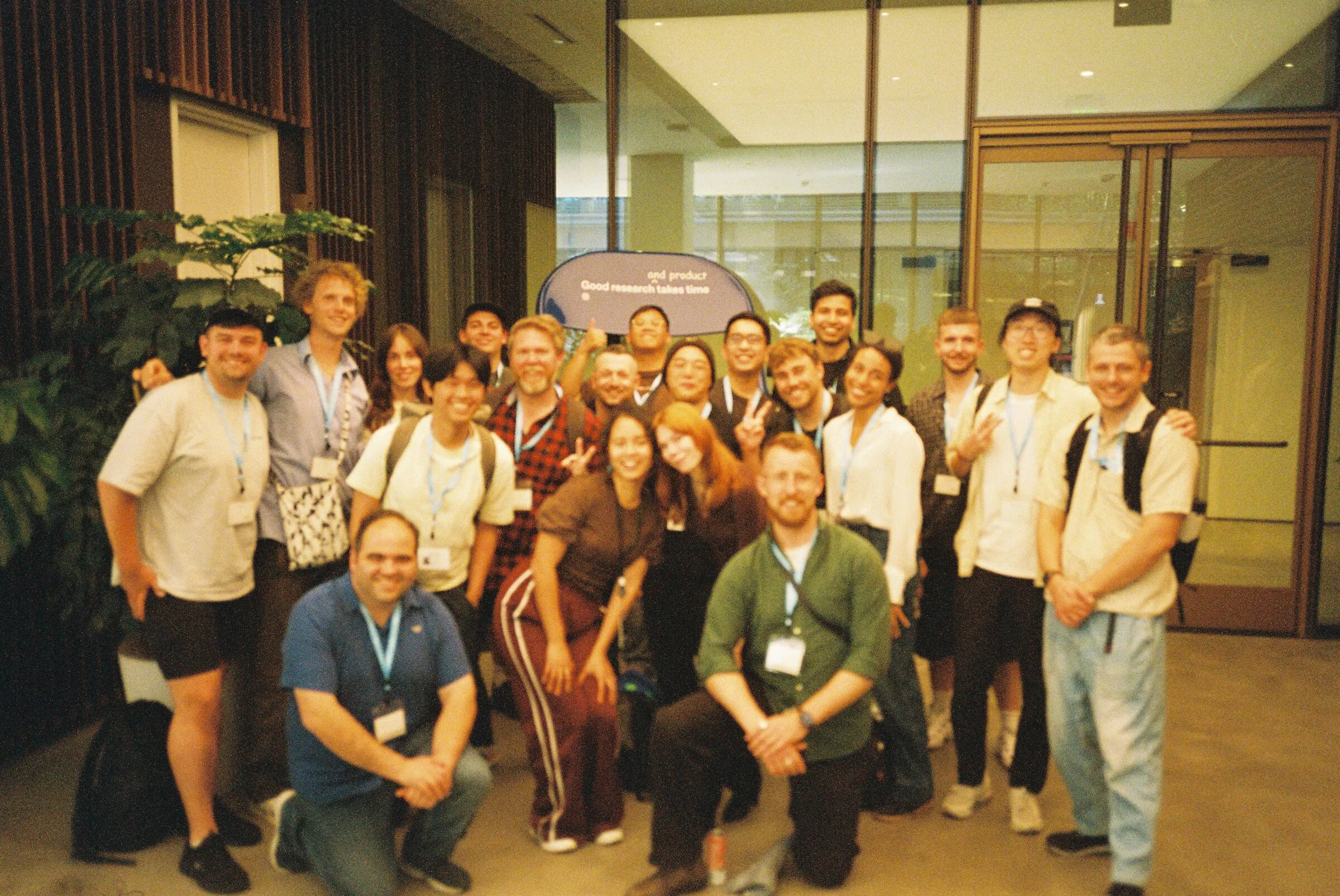 A large group photo in an office lobby