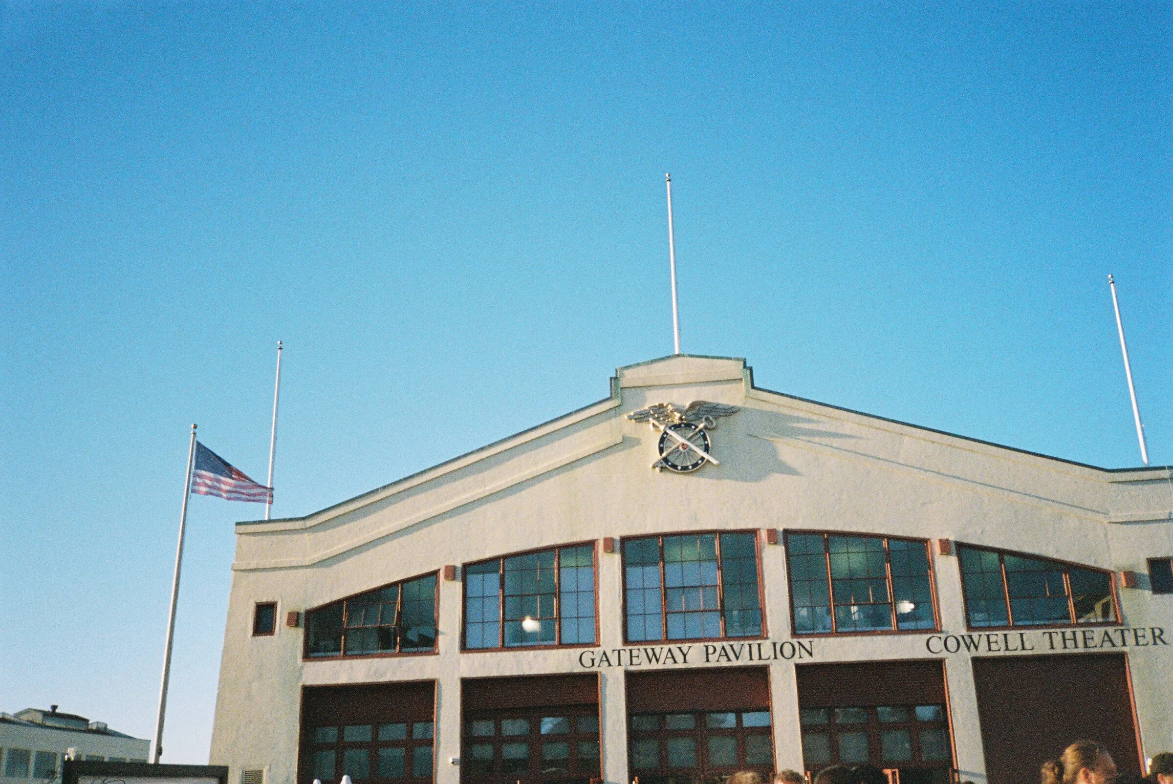 The Gateway Pavilion facade under a clear blue sky
